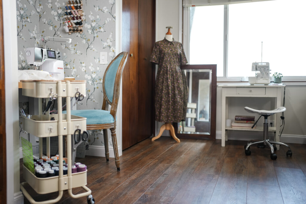 image of sewing room with a mannequin and a cart