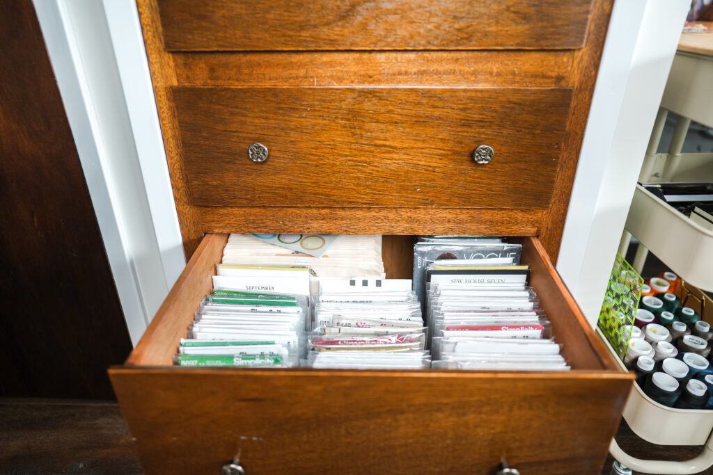 sewing patterns organized in a drawer