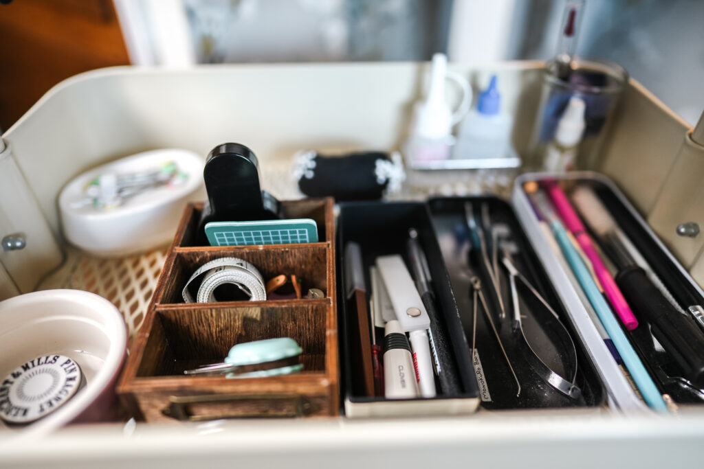 a tray with different sewing tools